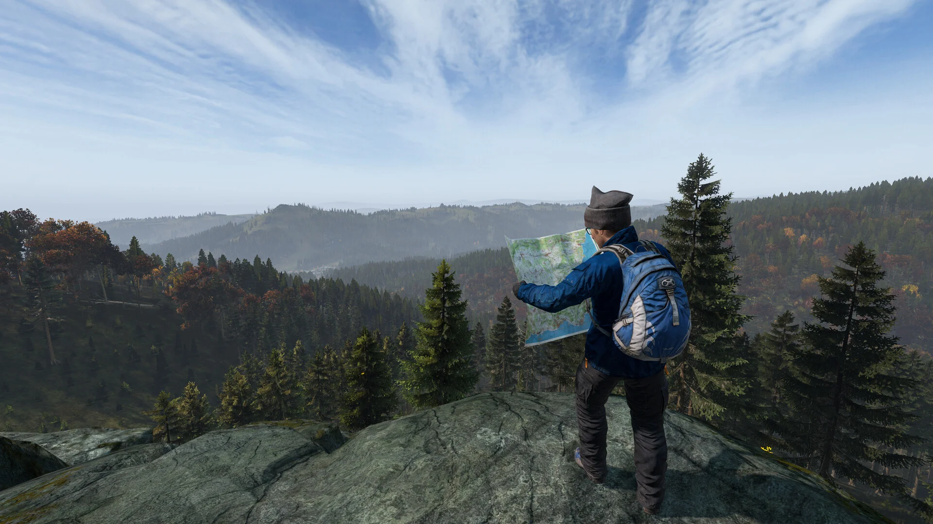 En överlevare läser en karta på en ås ovanför en dal i DayZ
